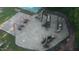 Aerial view of a spacious playground with multiple swings, slides, and play structures for children to enjoy at 1119 Sagamore Dr, Louisburg, NC 27549