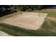Aerial shot of a sandy beach volleyball court, perfect for outdoor recreation and community fun at 1119 Sagamore Dr, Louisburg, NC 27549