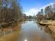 Scenic water view showcasing the lake with trees surrounding the shore at 1119 Sagamore Dr, Louisburg, NC 27549