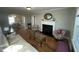 Cozy living room with hardwood floors, a fireplace, and a seamless flow to the adjacent dining area at 1302 E Jones St, Raleigh, NC 27610