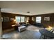 This living room boasts wood walls, tile floors, natural light, and comfortable seating at 1302 E Jones St, Raleigh, NC 27610