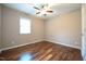 Bedroom with hardwood floors, ceiling fan, and one window at 1508 Woods Creek Dr, Garner, NC 27529