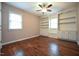Bedroom with hardwood floors, ceiling fan, and built in shelves at 1508 Woods Creek Dr, Garner, NC 27529