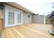 View of the deck with double doors leading to the house, offering a seamless indoor-outdoor flow at 1508 Woods Creek Dr, Garner, NC 27529