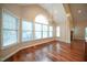 Bright dining room featuring hardwood floors, a chandelier, and large windows with lots of natural light at 1508 Woods Creek Dr, Garner, NC 27529