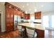 Modern kitchen features stainless appliances, granite countertops, and a kitchen island with bar stool seating at 1508 Woods Creek Dr, Garner, NC 27529