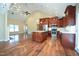 Spacious kitchen features stainless steel appliances, a large island, and hardwood floors at 1508 Woods Creek Dr, Garner, NC 27529
