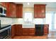 This kitchen features stone counters, stainless appliances and black dishwasher at 1508 Woods Creek Dr, Garner, NC 27529