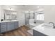 Modern bathroom with a soaking tub, walk-in shower, and double vanity at 168 Begonia St, Angier, NC 27501