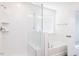 Modern bathroom with white tile shower and soaking tub at 2012 Clydner Dr, Apex, NC 27523