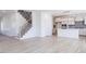Open concept kitchen with island, stainless steel appliances, and white cabinets at 2012 Clydner Dr, Apex, NC 27523