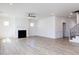 Spacious living room with hardwood floors, fireplace, and access to the kitchen at 2012 Clydner Dr, Apex, NC 27523