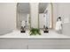 Double vanity with black matte faucets and arched mirrors at 2207 Edwin Ave, Durham, NC 27705