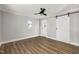 Spacious bedroom featuring a barn door and ceiling fan at 2207 Edwin Ave, Durham, NC 27705