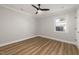 Light-filled bedroom with modern ceiling fan and stylish wood-look floors at 2207 Edwin Ave, Durham, NC 27705