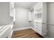Bright walk-in closet with built-in shelves and drawers at 2207 Edwin Ave, Durham, NC 27705