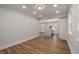 An open dining room leading into the kitchen with recessed lighting and wood floors at 2207 Edwin Ave, Durham, NC 27705