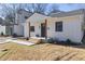 Modern white house with a stylish front porch and walkway at 2207 Edwin Ave, Durham, NC 27705