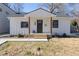 Charming white farmhouse-style home with a covered porch at 2207 Edwin Ave, Durham, NC 27705