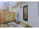 Side view of house showing exterior door and gate at 2207 Edwin Ave, Durham, NC 27705