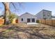 Rear view of house, showcasing patio and yard at 2207 Edwin Ave, Durham, NC 27705