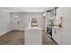 Bright kitchen featuring a large island with granite countertops and stainless steel appliances at 2207 Edwin Ave, Durham, NC 27705