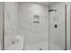Modern marble walk-in shower with built-in seat at 2207 Edwin Ave, Durham, NC 27705
