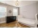 Bright bedroom with hardwood floors, large windows, and classic design at 505 Annandale Dr, Cary, NC 27511