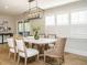 Elegant dining room with a modern chandelier, shutters, and comfortable seating for six at 505 Annandale Dr, Cary, NC 27511