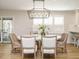 Elegant dining room with a modern chandelier, shutters, and comfortable seating at 505 Annandale Dr, Cary, NC 27511