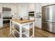 Kitchen featuring white cabinets, granite countertops, and stainless steel appliances at 505 Annandale Dr, Cary, NC 27511