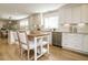 Kitchen featuring white cabinets, granite countertops, and stainless steel appliances at 505 Annandale Dr, Cary, NC 27511