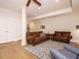 Inviting living room with hardwood floors, ceiling fan, recessed lighting, and comfortable seating on a patterned area rug at 505 Annandale Dr, Cary, NC 27511