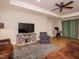 Spacious living room featuring hardwood floors, ceiling fan, recessed lighting, and comfortable seating on a patterned area rug at 505 Annandale Dr, Cary, NC 27511