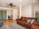 Comfortable living room with ceiling fan, hardwood floors, and plentiful doorways at 505 Annandale Dr, Cary, NC 27511