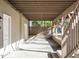Covered patio with exposed ceiling beams and steps leading to backyard at 505 Annandale Dr, Cary, NC 27511