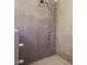 A modern shower featuring sleek tile work, contemporary fixtures, and a minimalist design at 505 Annandale Dr, Cary, NC 27511