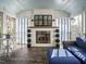 Charming sunroom featuring a fireplace and views of the surrounding trees at 505 Annandale Dr, Cary, NC 27511