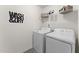 Laundry room with washer, dryer, and shelving at 517 Marthas View Way, Wake Forest, NC 27587