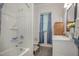 Bathroom with tub, shower, and white vanity at 607 Young St, Henderson, NC 27536