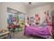 bedroom with two twin beds and colorful decor at 607 Young St, Henderson, NC 27536
