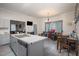 Bright dining area with table and chairs, open to the kitchen at 607 Young St, Henderson, NC 27536