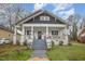 Charming craftsman style home with a front porch and well-manicured lawn at 607 Young St, Henderson, NC 27536