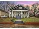 Charming craftsman style home with a front porch and well-manicured lawn at 607 Young St, Henderson, NC 27536