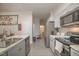 Modern kitchen with gray cabinets, stainless steel appliances, and an island at 607 Young St, Henderson, NC 27536