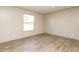 Bright bedroom with vinyl flooring and a large window at 6545 Old Jefferson Davis Hwy, Cameron, NC 28326