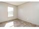 Simple bedroom with wood-look flooring and large window at 6545 Old Jefferson Davis Hwy, Cameron, NC 28326