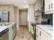 Modern kitchen with island, stainless steel appliances, and light wood cabinets at 6545 Old Jefferson Davis Hwy, Cameron, NC 28326