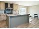 Modern kitchen with island, stainless steel appliances and light wood cabinets at 6545 Old Jefferson Davis Hwy, Cameron, NC 28326