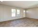 Open living space with large windows and access to a deck at 6545 Old Jefferson Davis Hwy, Cameron, NC 28326